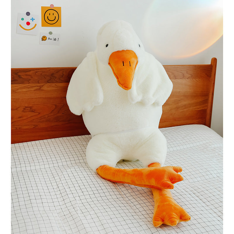 Child hugging a soft white goose plush toy—perfect for cuddles, naps, and imaginative playtime.