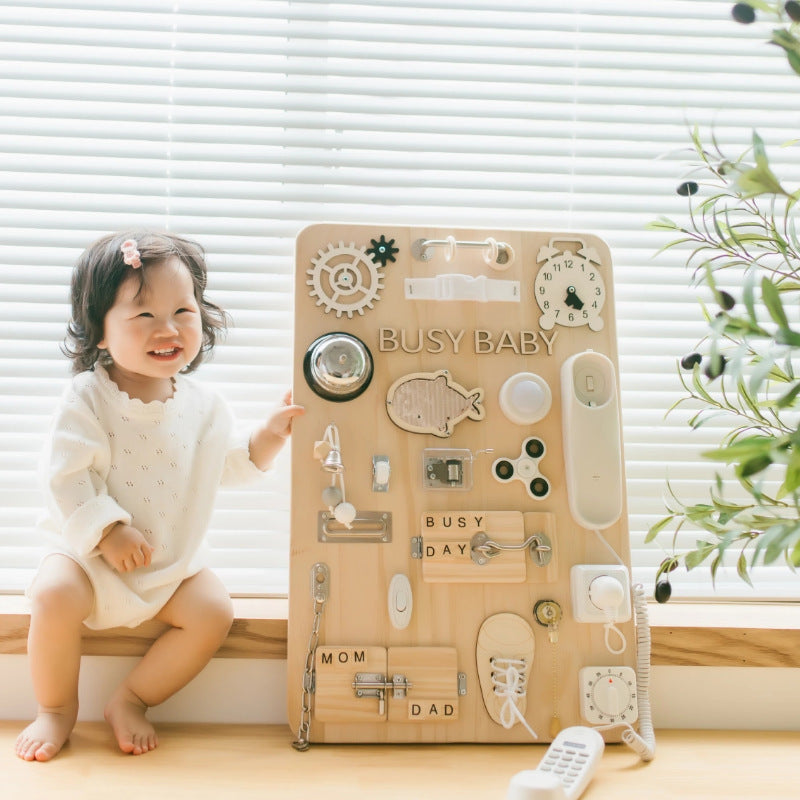 Montessori-style baby busy board with educational elements, ideal for toddlers and problem-solving