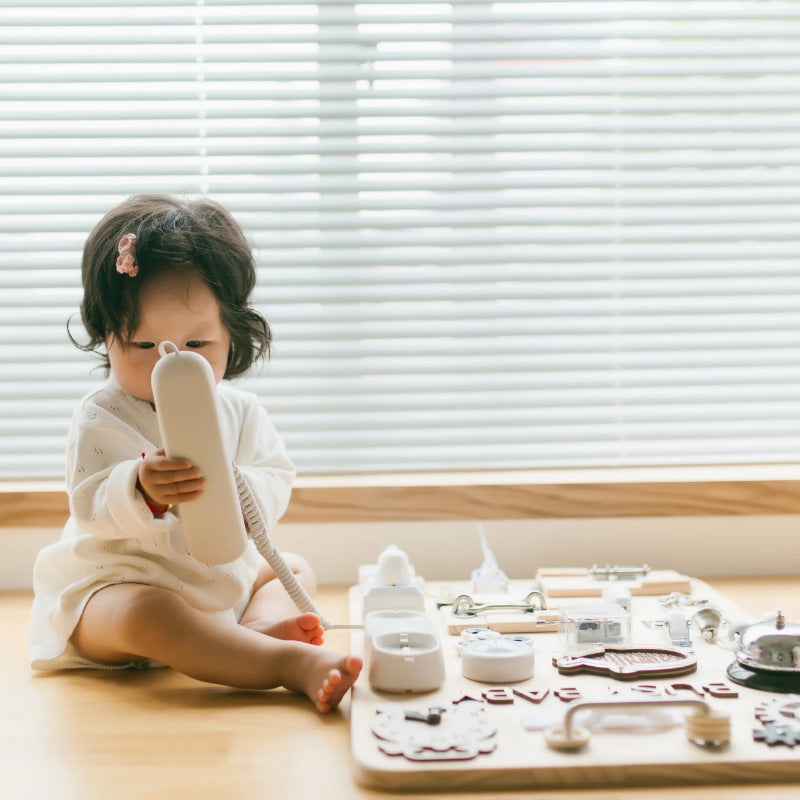 Wooden baby learning & development busy board packed with fun activities that help infants build coordination and focus through hands-on play